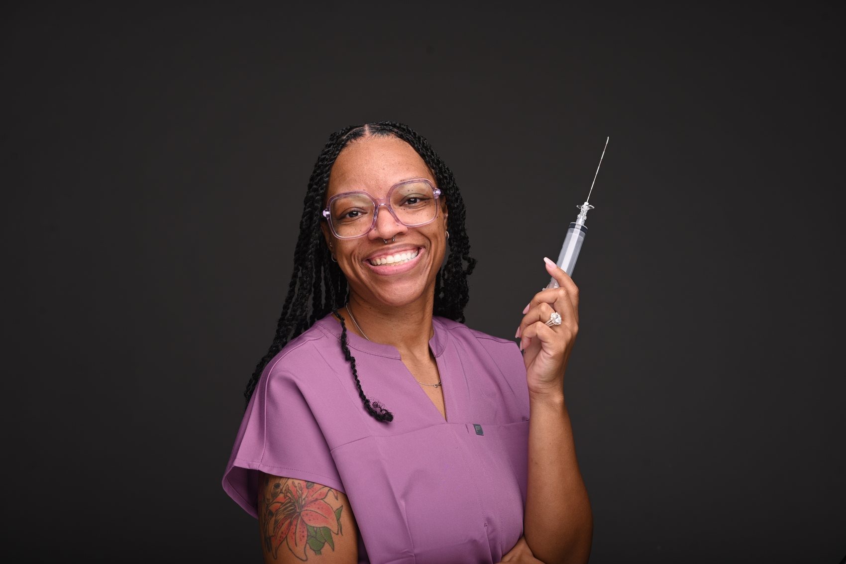 Dr. DeVontee' Rayford, DNP, CRNA, in scrubs